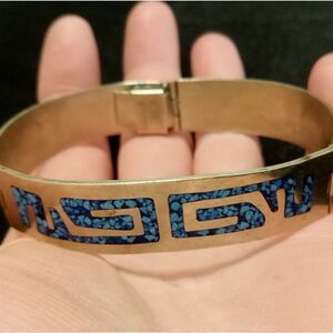 Silver hinged bracelet inlaid with blue designs, stamped alpaca mexico